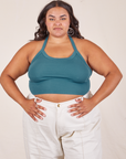 Alicia is 5'9" and wearing XL Halter Top in Marine Blue paired with vintage off-white Western Pants