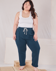 Ashley is 5'7" and wearing L Rolled Cuff Sweat Pants in Lagoon paired with Cropped Tank in vintage tee off-white