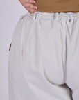 Pleated Trouser Shorts in Dishwater White back close up on Juliet