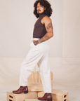 Side view of Heavyweight Trousers in Vintage Tee Off-White and espresso brown Sleeveless Turtleneck worn by Jesse