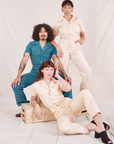 Heritage Short Sleeve Jumpsuit in Marine Blue worn by Jesse. Tiara and Alex are wearing the same jumpsuit in vintage off-white
