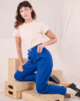 Alex is wearing Heritage Trousers in Royal Blue and Organic Vintage Tee in vintage tee off-white