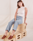 Alex is wearing Heritage Westerns in Periwinkle and Sleeveless Turtleneck in vintage tee off-white