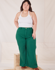 Ashley is 5'7" and wearing 1XL Bell Bottoms in Hunter Green paired with a Halter Top in vintage tee off-white