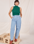 Tiara is 5'4" and wearing XS Sleeveless Essential Turtleneck in Hunter Green