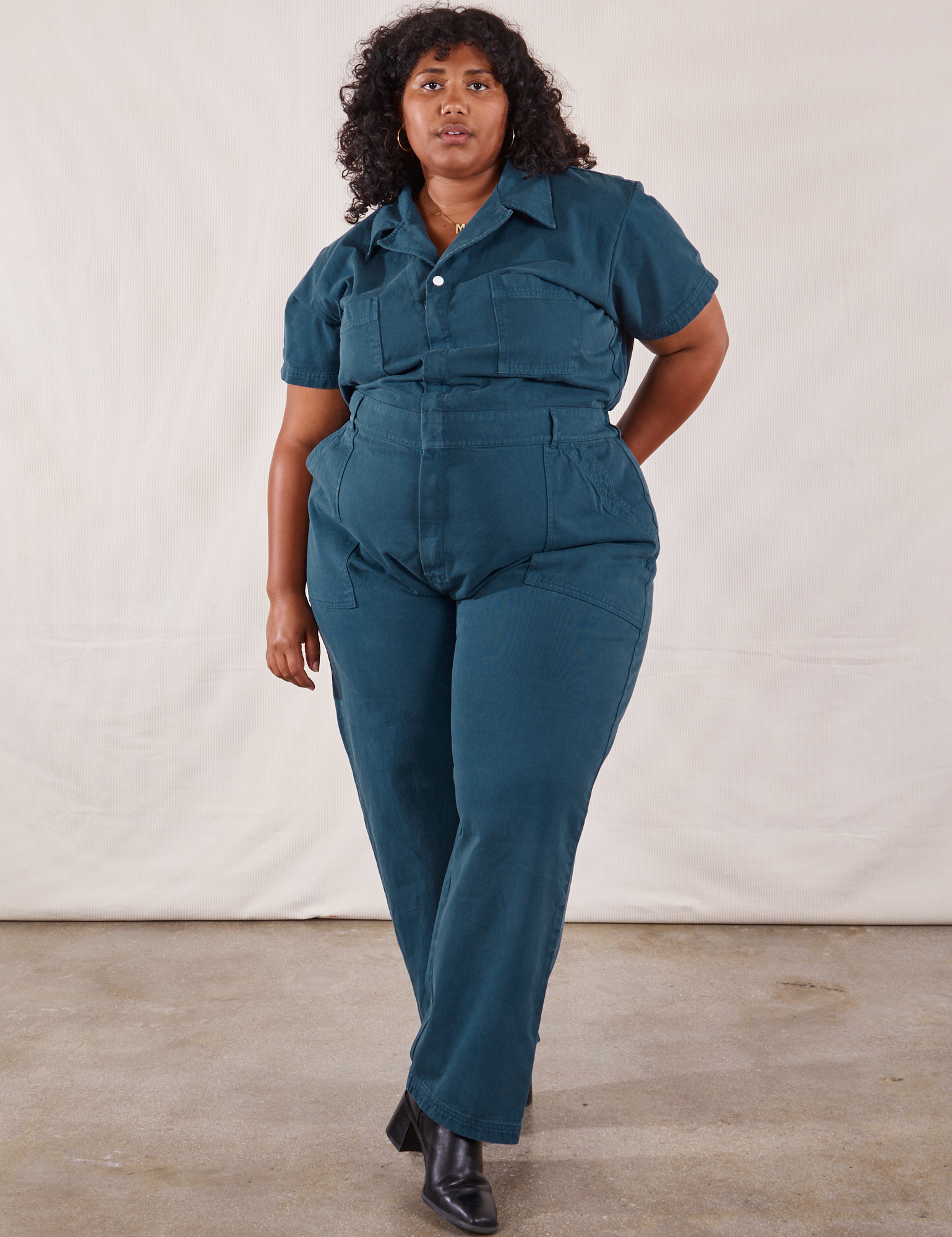 Morgan is 5'5" and wearing 2XL Short Sleeve Jumpsuit in Lagoon