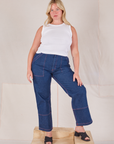Lish is wearing Muscle Tee in Vintage Tee Off-White and dark wash Carpenter Jeans
