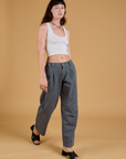 Baggy Mid-Rise Trousers in Slate Grey and vintage tee white Cropped Tank on Alex
