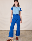 Alex is wearing Mismatched Tee in Baby & Royal Blue and royal blue Western Pants