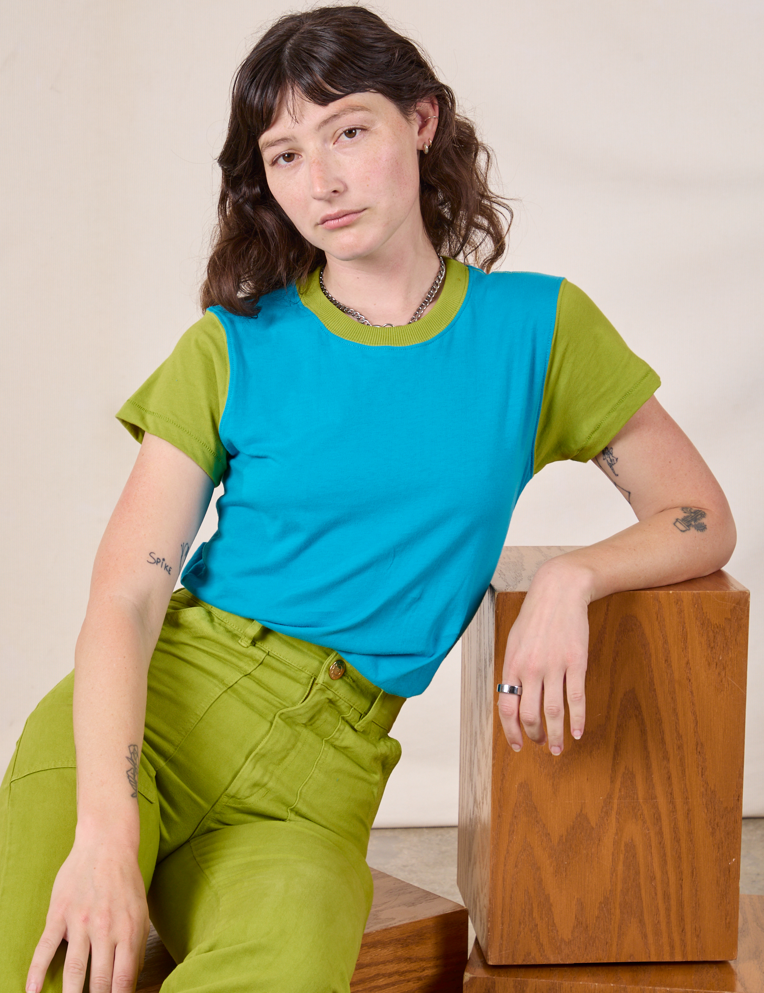 Mismatched Tee in Blue & Green and gross green Work Pants on Alex