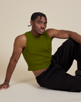 Isaac is wearing Muscle Tee in Summer Olive