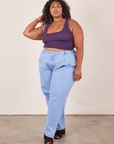 Morgan is wearing Cropped Tank Top in Nebula Purple and light wash Trouser Jeans