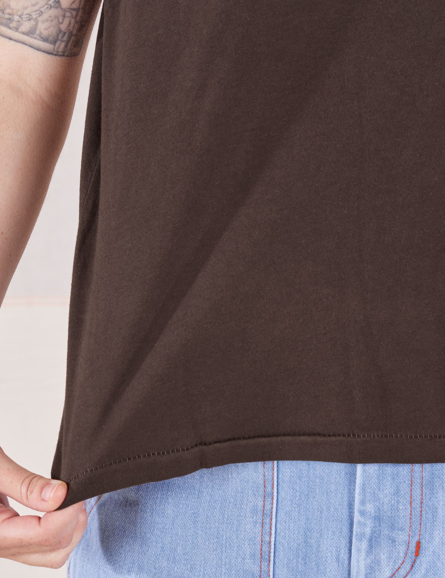 Organic Vintage Tee in Espresso Brown bottom hem close up on Hana