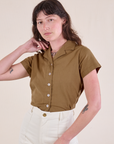 Alex has the Pantry Button-Up in Desert Brown tucked into vintage tee off-white Western Pants