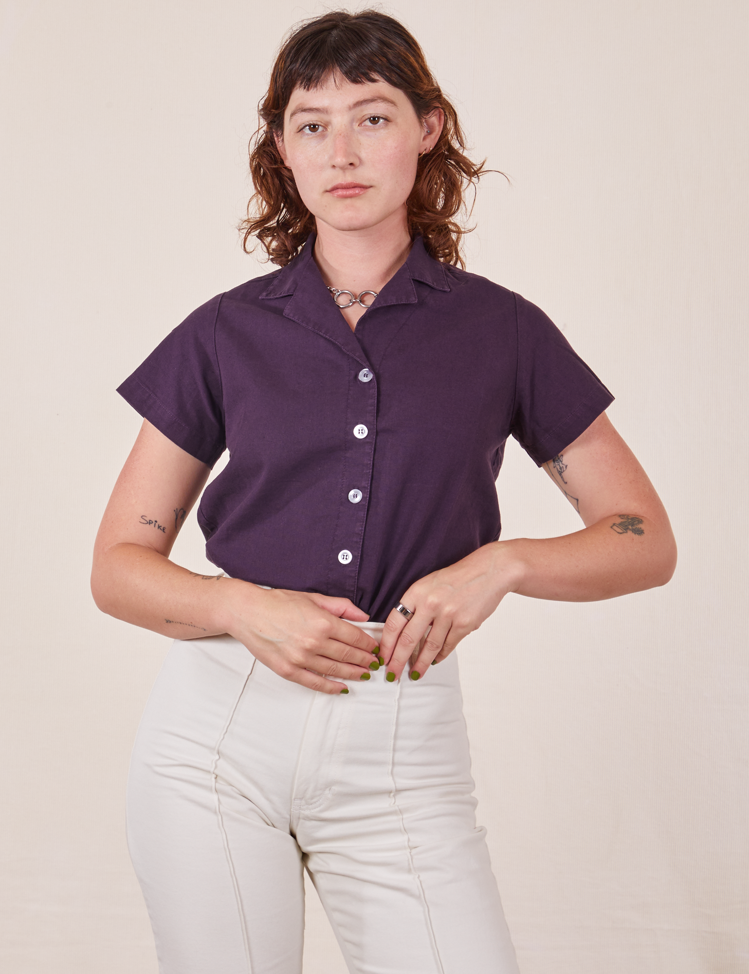 Alex is wearing P Pantry Button-Up in Nebula Purple tucked into vintage tee off-white Western Pants