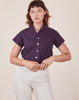 Alex is wearing P Pantry Button-Up in Nebula Purple tucked into vintage tee off-white Western Pants