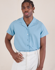 Isaac is 5'10" and wearing M Pantry Button-Up in Baby Blue