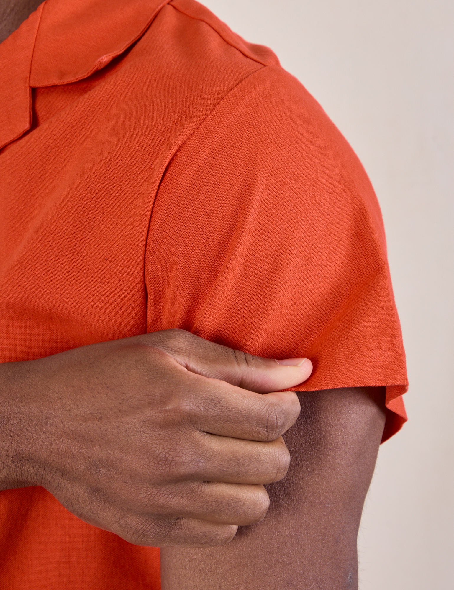 Pantry Button-Up in Chili Red sleeve close up on Isaac