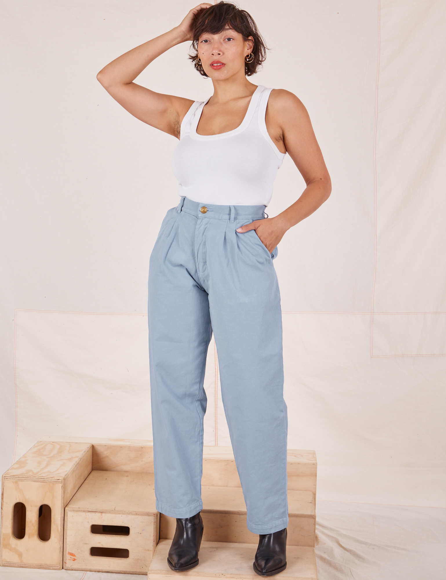 Tiara is 5&#39;4&quot; and wearing XS Heavyweight Trousers in Periwinkle paired with Cropped Tank Top in vintage tee off-white