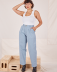 Tiara is 5'4" and wearing XS Heavyweight Trousers in Periwinkle paired with Cropped Tank Top in vintage tee off-white