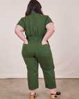 Petite Short Sleeve Jumpsuit in Dark Emerald Green back view on Ashley