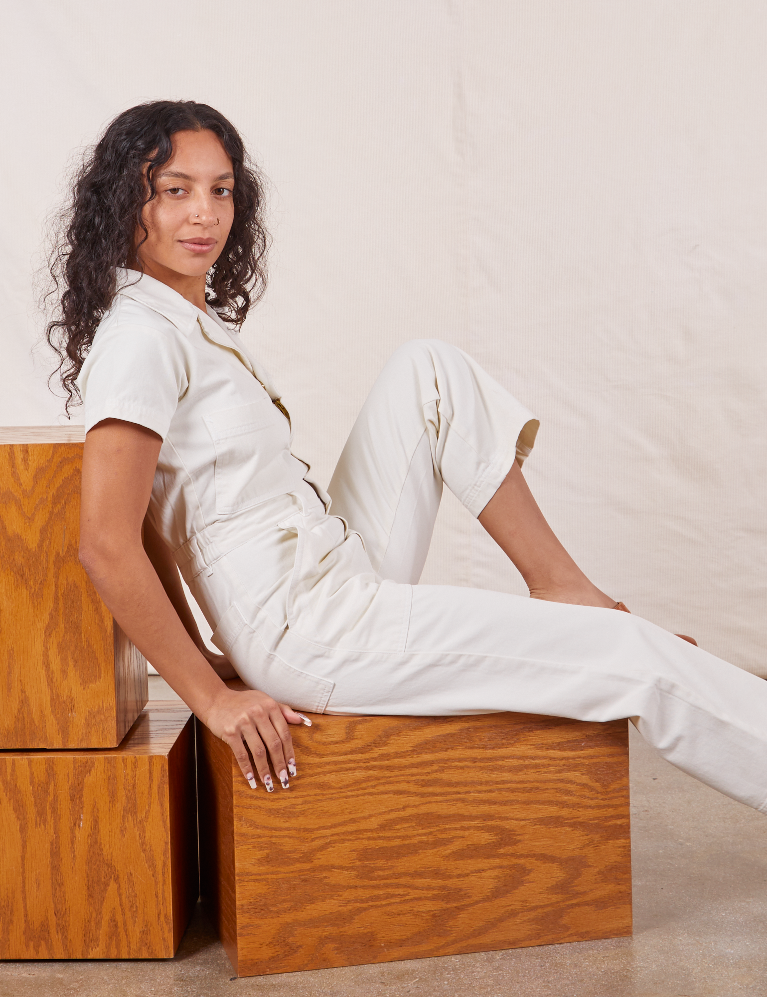 Blair is wearing Petite Short Sleeve Jumpsuit in Vintage Tee Off-White