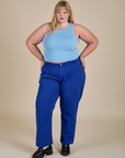 Juliet is wearing Racerback Tank in Baby Blue and Work Pants in Royal Blue