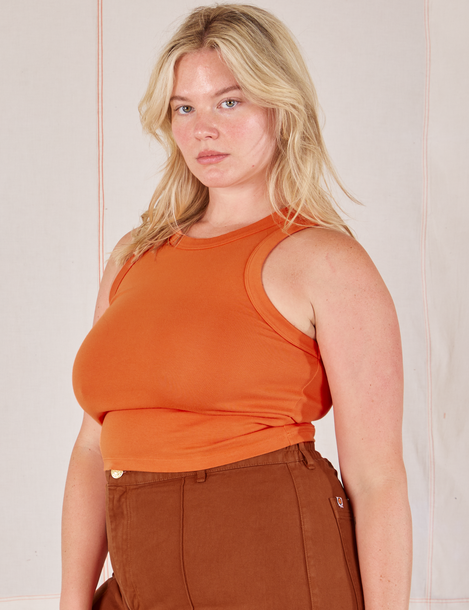 Racerback Tank in Sunset Orange angled front view on Lish