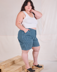 Side view of Railroad Carpenter Shorts in Baby Blue and Cropped Tank in Vintage Tee Off-White on Ashley