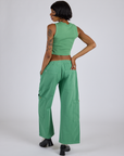 Back view of Drop Pocket Cargo Pants in Seafoam Green and matching Muscle Tee on Kira