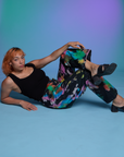 Tiara is wearing Work Pants in Rainbow Magic Waters and black Cropped Tank in Black