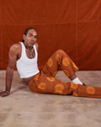 Paintstamped Work Pants in Orange and Cropped Tank in Vintage Tee Off-White on Jerrod