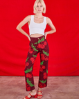 Madeline is 5'9" and wearing XXS Paintstamped Work Pants in Cherry paired with a Cropped Tank in Vintage Tee Off-White