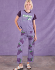 Madeline is wearing Vintage Tee in Grape Soda and Paintstamped Work Pants in Grape