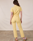 Short Sleeve Jumpsuit in Butter Yellow back view on Alex