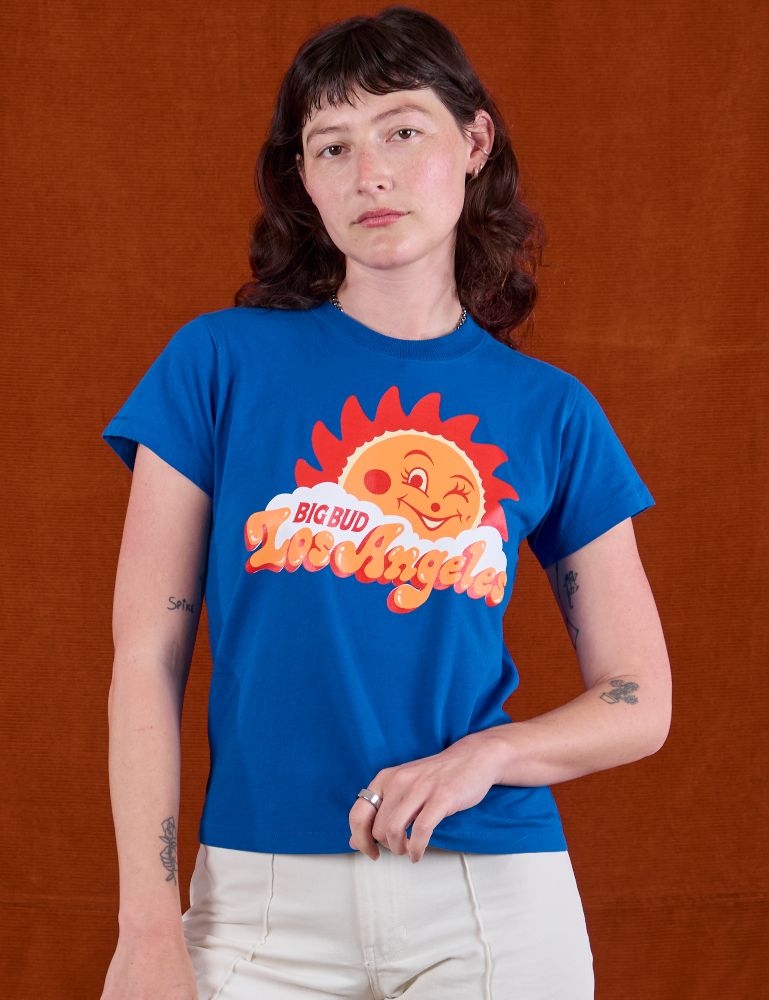 Alex is 5'8" and wearing P Sunny Los Angeles Tourist Tee
