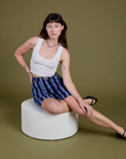 Alex is wearing Longline Work Shorts in Cornflower and Cropped Tank in Vintage Tee White