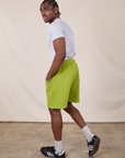 Sweat Shorts in Gross Green side view on Isaac
