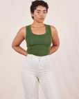 Mika is wearing size P Tank Top in Dark Emerald Green paired with vintage tee off-white Western Pants