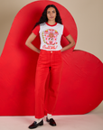 Shahana is 5’10 and wearing P Vintage Tee in Call Me paired with mustang red Work Pants
