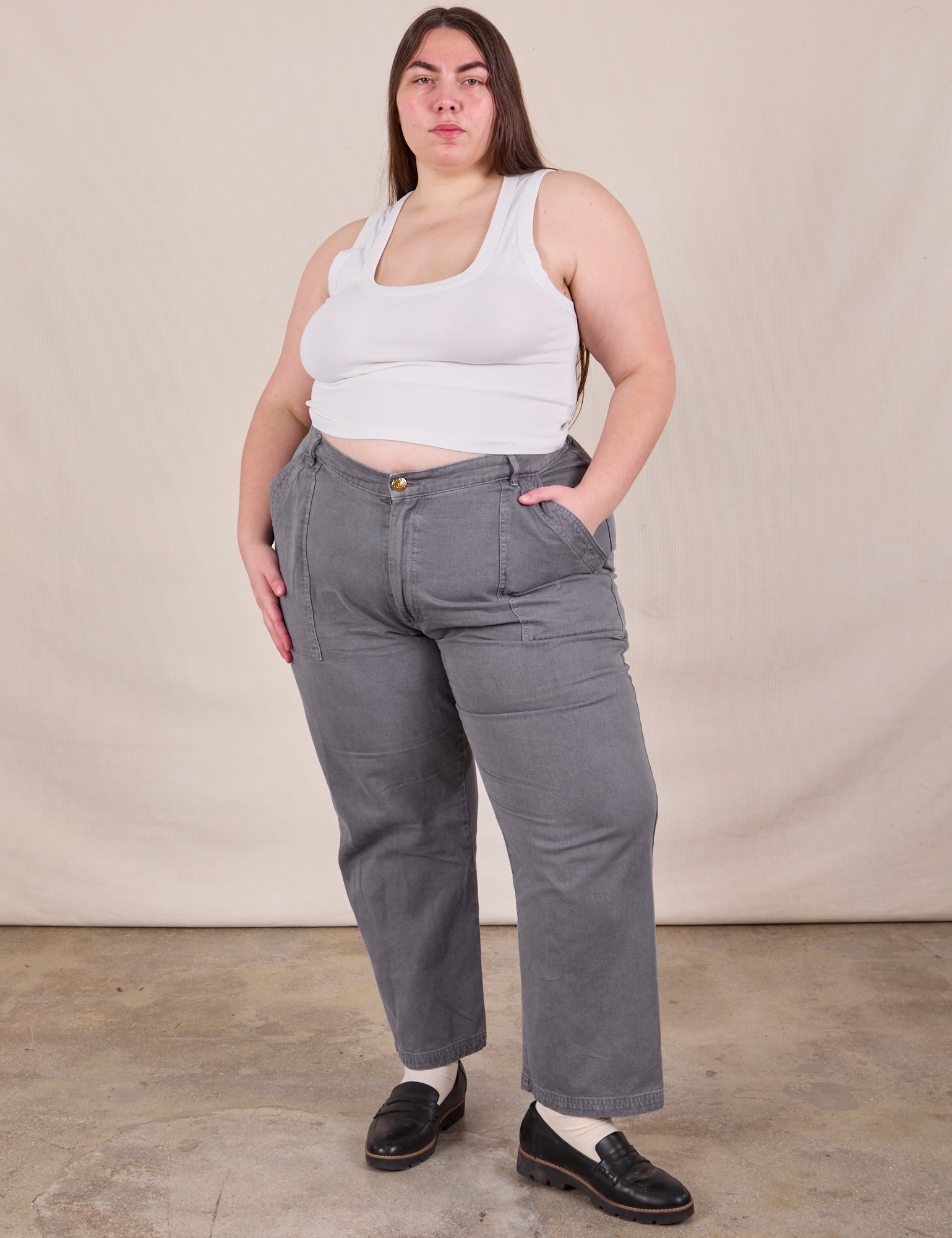 Marielena is 5'8" and wearing 2XL Work Pants in Washed Grey paired with Cropped Tank in vintage tee off-white