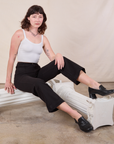 Alex is wearing Western Pants in Basic Black and Cropped Cami in vintage tee off-white