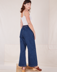 Angled back view of Indigo Wide Leg Trousers in Dark Wash on Alex