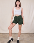 Alex is 5'8" and wearing XS Classic Work Shorts in Swamp Green paired with a Cropped Tank in Vintage Tee Off-White