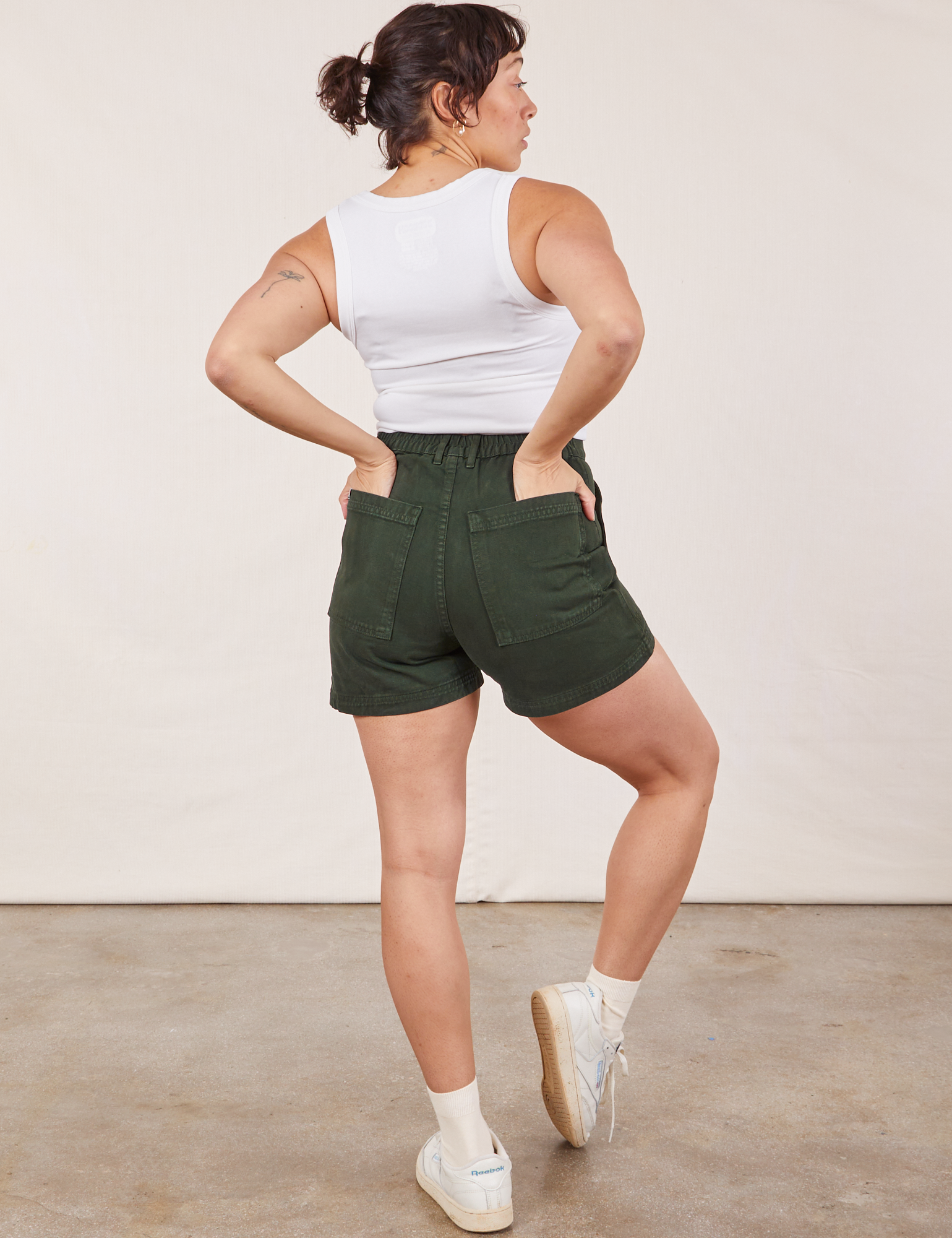 Back view of Classic Work Shorts in Swamp Green and Cropped Tank Top in vintage tee off-white on Tiara