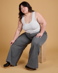 Ashley is wearing Heritage Wide Leg Trousers in Washed Grey and vintage tee white Cropped Tank
