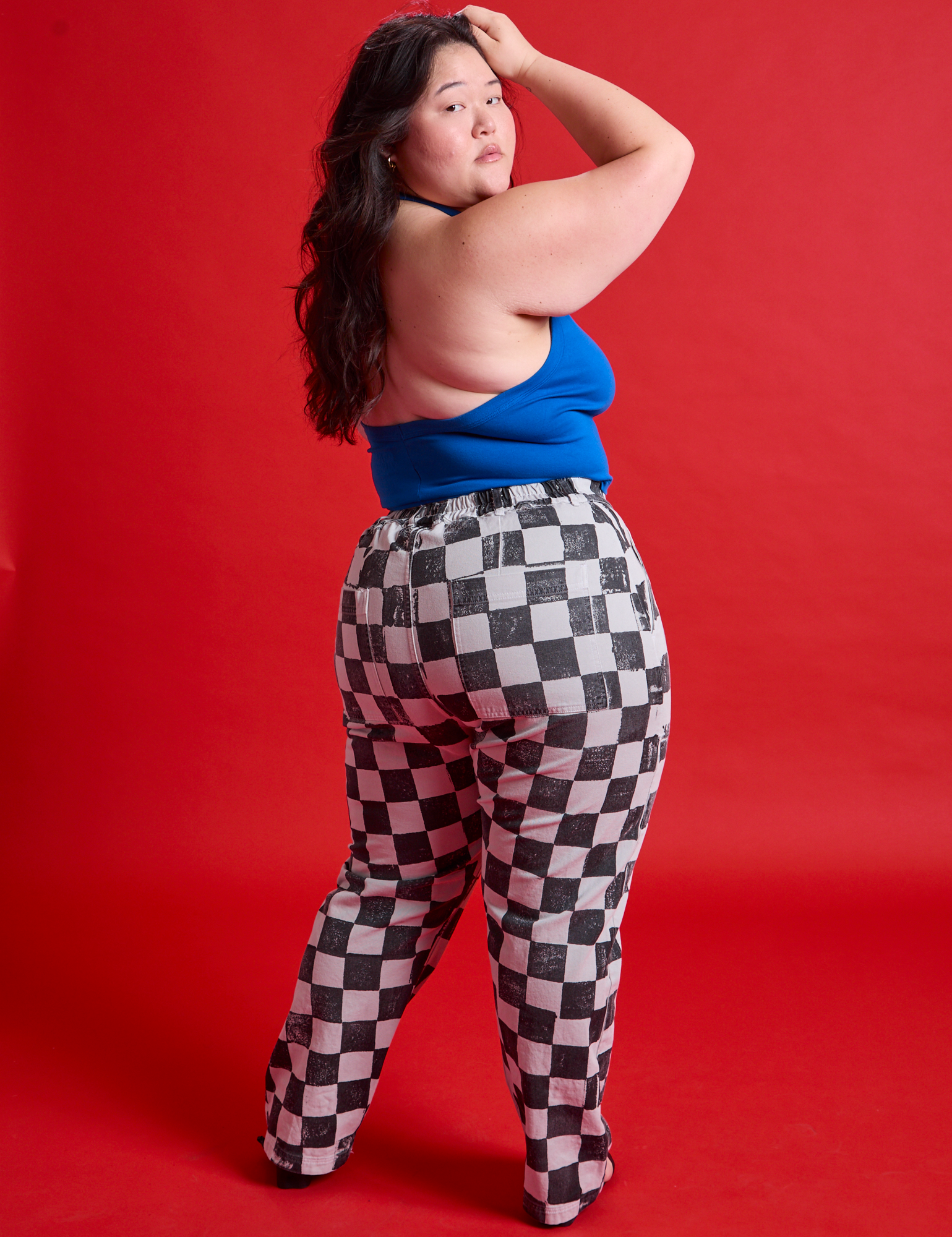 Back view of Checkerboard Work Pants in Black/White and royal blue Halter Top