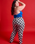 Back view of Checkerboard Work Pants in Black/White and royal blue Halter Top