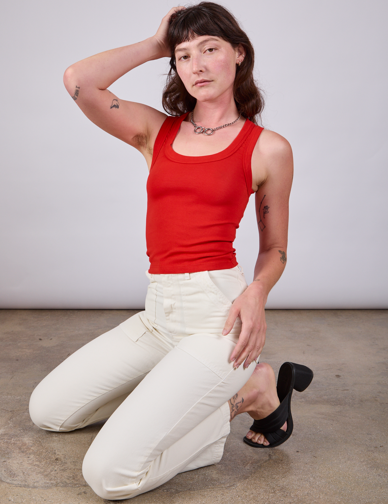 Tank Top in Mustang Red and vintage tee off-white Work Pants worn by Alex