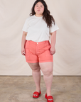 Ashley is 5’7” and wearing 1XL Classic Work Shorts in Flamingo Pink paired with an Organic Vintage Tee in Vintage Tee Off-White
